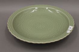 A large Chinese celadon charger. 41.5 cm diameter.