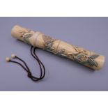 A Japanese bone cigar holder. 13.25 cm long.