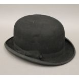 A Dunn & Co bowler hat.