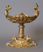 A gilt bronze cherub tazza. 21.5 cm high.