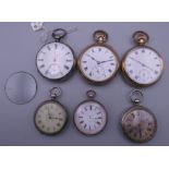 A small collection of pocket watches, some silver.