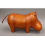 A leather hippo footstool.