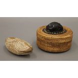 An Indonesian woven circular box the lid inlaid with mother-of-pearl and mounted with wooden fish,