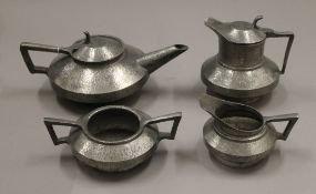 A pewter tea set.