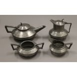 A pewter tea set.