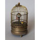 A birdcage clock. 13.5 cm high.
