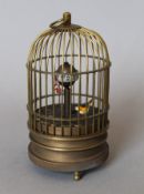 A birdcage clock. 13.5 cm high.