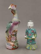 A 19th century Chinese porcelain bird and an 18th century Chinese porcelain figure of a laughing