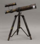 A telescope on stand. 25.5 cm long.