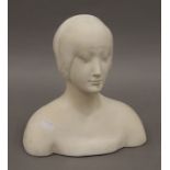 A plaster bust of a lady. 23 cm high.
