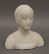 A plaster bust of a lady. 23 cm high.