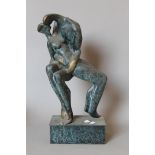 An abstract patinated bronze sculpture of a couple kissing. 44 cm high.