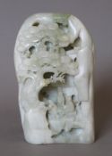 A Chinese carved jade boulder. 16 cm high.