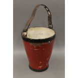 A 19th century fire bucket. 34 cm high.