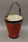 A 19th century fire bucket. 34 cm high.