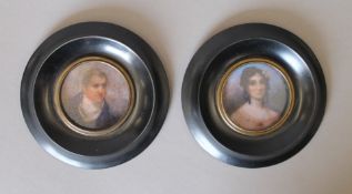 A pair of framed miniatures. 13 cm diameter overall.