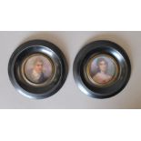 A pair of framed miniatures. 13 cm diameter overall.
