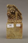 A large Chinese soapstone seal surmounted with an eagle. 19 cm high.