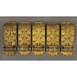 A set of five 19th century carved gilt wood corbels. Each 37 cm high.