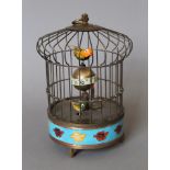 A cloisonne birdcage clock. 20 cm high.