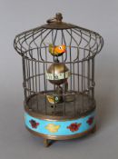 A cloisonne birdcage clock. 20 cm high.