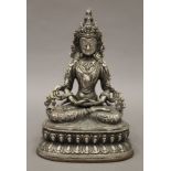 A silvered bronze model of a Buddha. 21.5 cm high.