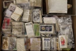 A large box of mainly tea cards and some cigarette cards