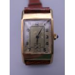 An Art Deco 9 ct gold gentleman's wristwatch. 2.25 cm wide.