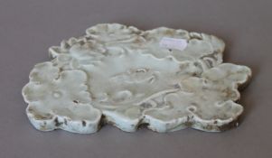 A Chinese celadon pottery brush washer decorated with a crab. 20 cm wide.