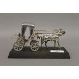 A Maltese silver model of a horse and carriage mounted on a wood base, stamped Handmade,