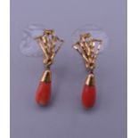 A pair of 18 ct gold coral earrings. 2.2 grammes total weight.