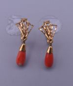 A pair of 18 ct gold coral earrings. 2.2 grammes total weight.