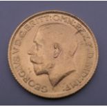 A 1911 gold sovereign.