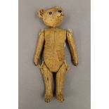 A model of a teddy bear. 21 cm high.