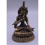 A small bronze model of Buddha. 10 cm high.
