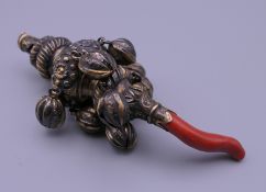 A Victorian silver gilt rattle. 12 cm long. 52.8 grammes total weight.