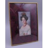 A 19th century miniature portrait of a young lady, in a gilt bronze frame. 13 x 18 cm overall.