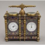 A double cloisonne carriage clock/barometer. 12.5 cm wide.