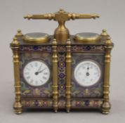 A double cloisonne carriage clock/barometer. 12.5 cm wide.