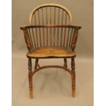 A 19th century elm seated stick back Windsor chair. 52 cm wide.