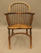 A 19th century elm seated stick back Windsor chair. 52 cm wide.