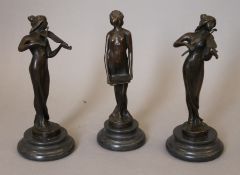 A set of three Art Nouveau style bronze musicians.