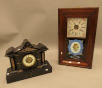 A 19th century mahogany wall clock and a Victorian black slate mantel clock. The latter 44 cm wide.