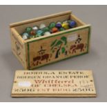 A box of vintage marbles.