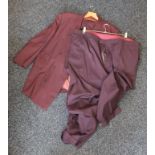 A burgundy suit with two pairs of trousers.