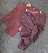 A burgundy suit with two pairs of trousers.