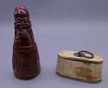 A carved horn figure of a sage and a horn snuff box. The former 11.5 cm high.