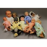 A quantity of vintage dolls.