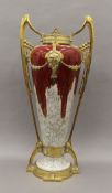 A Continental Art Nouveau brass mounted pottery vase. 69 cm high.