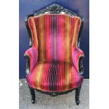 An upholstered armchair. 75 cm wide.